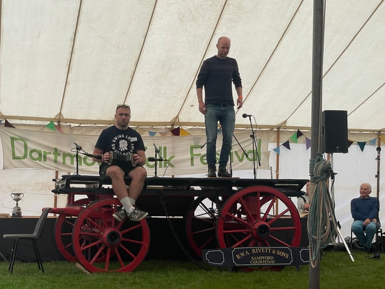 Matt Norman step dancing on the wagon during his prizewinning performance with musician Thomas White.  AQ 4369