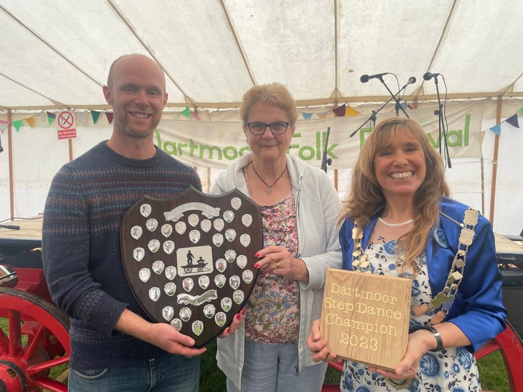 Matt Norman receiving the Dartmoor Step Dance Champion awards from president Shirley Bazeley, centre, and the Mayor of West Devon, right. AQ 4375