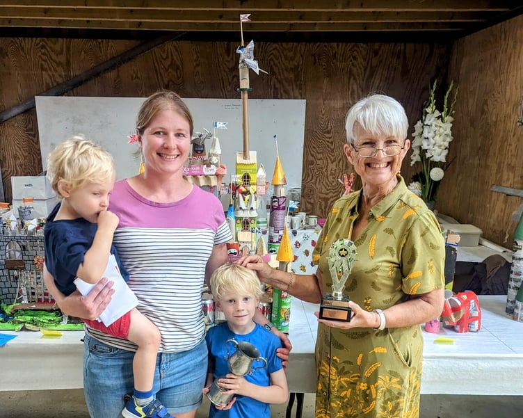 the Powell family of Okehampton  family won  the top award in the craft section for their fantastic many turretted castle-made entirely from recycled materials,including suitably curved coke cans