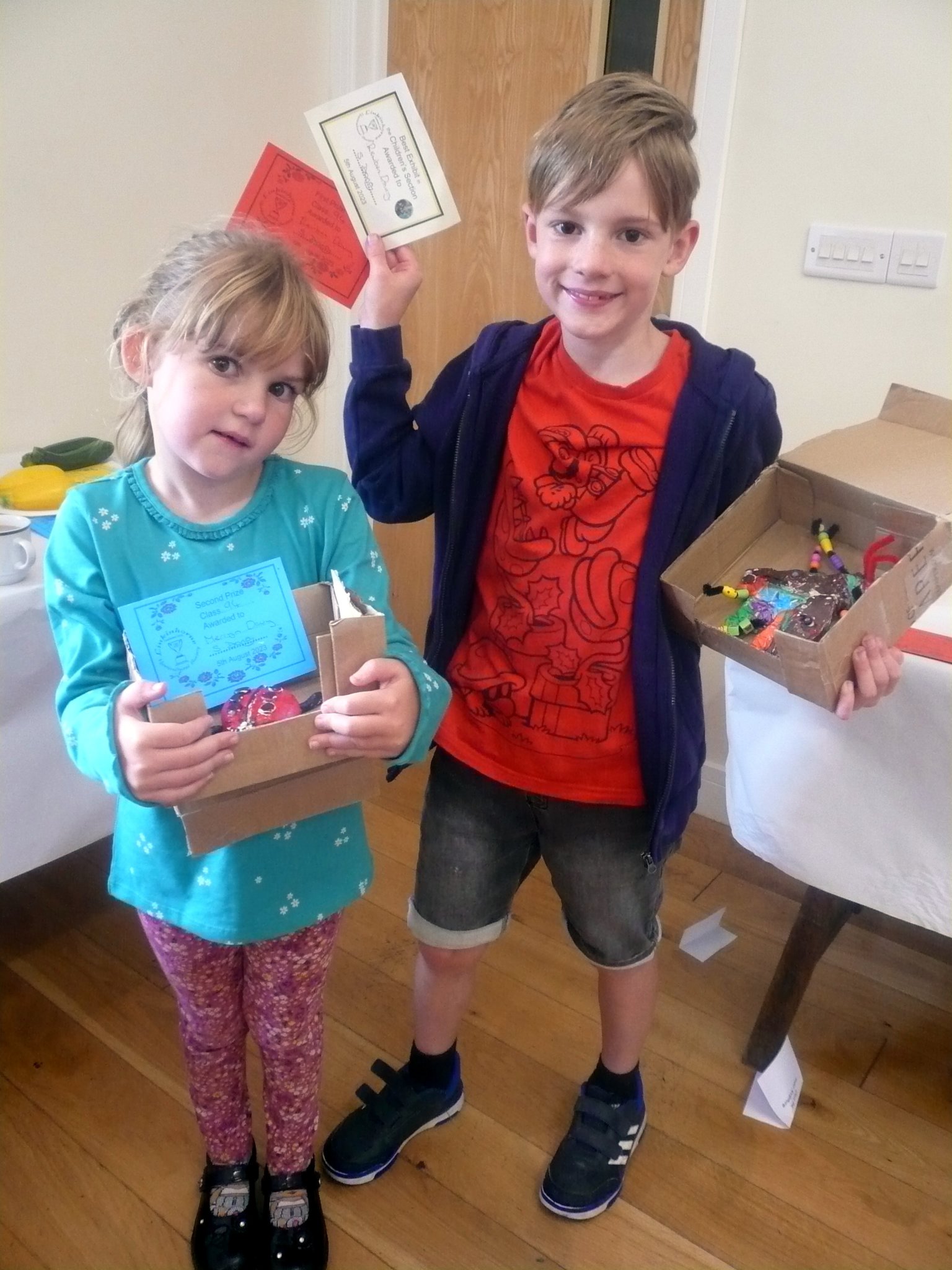 Reuben (1st) and sister Merryn Davy (3rd) with their winning entries in the Children’s Craft section