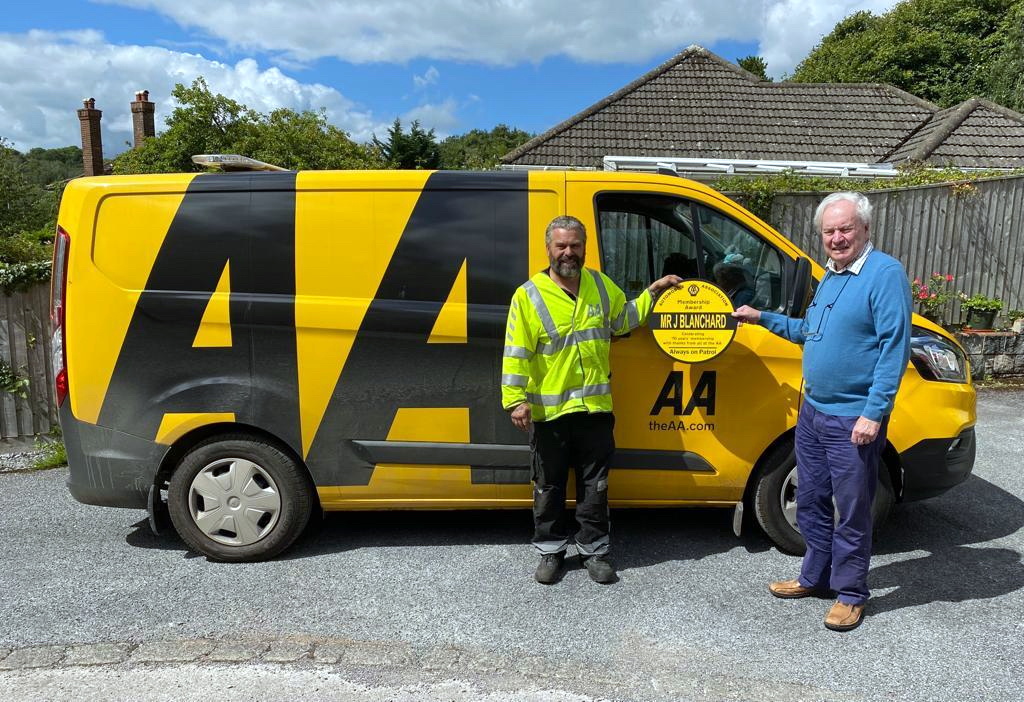 Above: 70 years and counting - John with a local AA van, a sight he has seen many times.
Below: While the membership remains, the car has changed. John now owns a Honda Jazz.