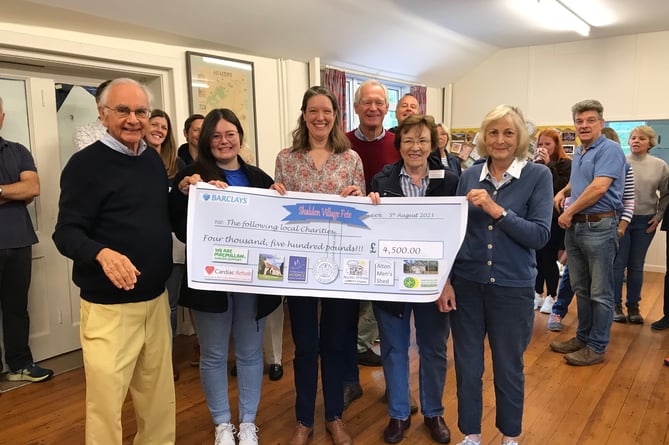 Shalden Village Fete 2023 presentation to charities. With the cheque are fete committee member Ian Champness were Louise Gough of St Michael’s Hospice, Lisa Henshaw of Cardiac Rehab, Margaret Warren of the Alton League of Friends, Cynthia Buchanan of St Peter and Paul Shalden Church and Mark Ommanney of Shalden Village Hall.