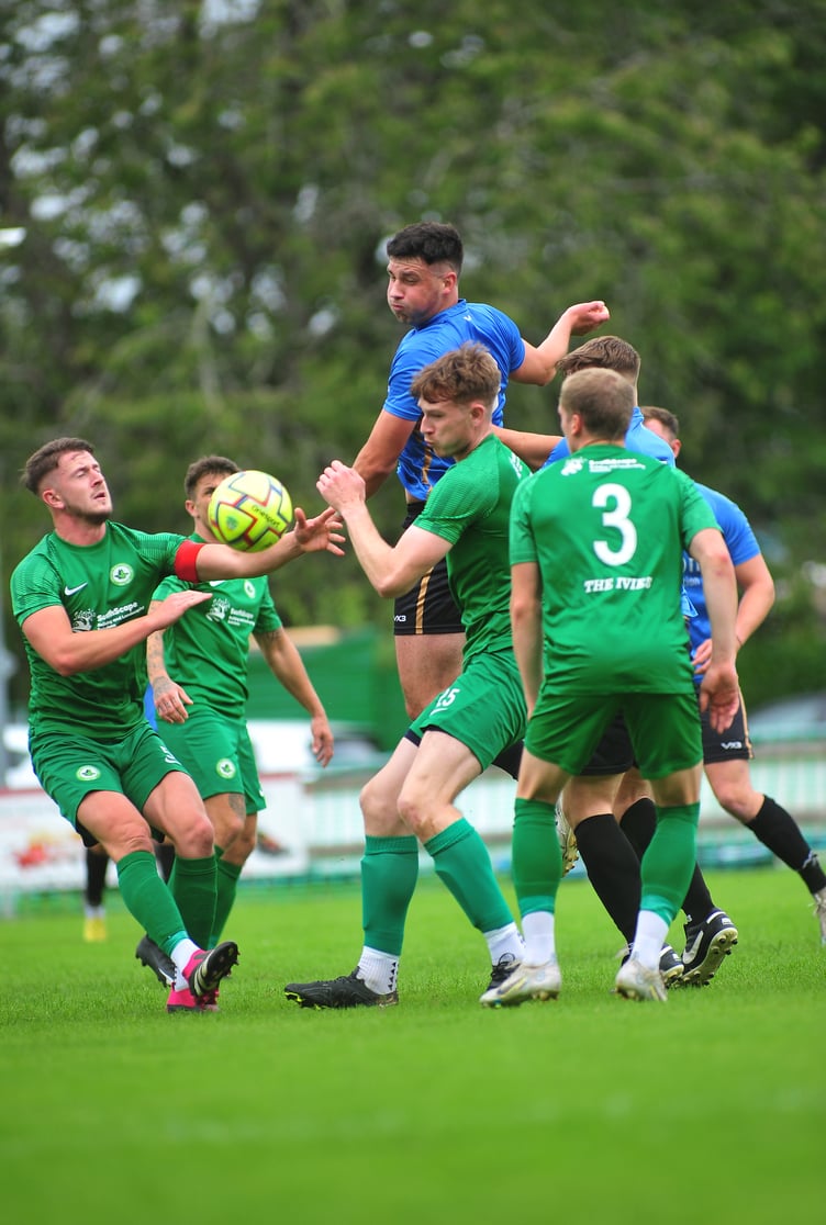 Action from the South West Peninsular League. Ivybridge Town versus Newton Abbot Spurs