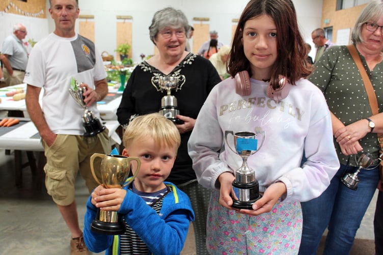Rufus Kelsall and Emily Jeffrey with their trophies. SR 8674