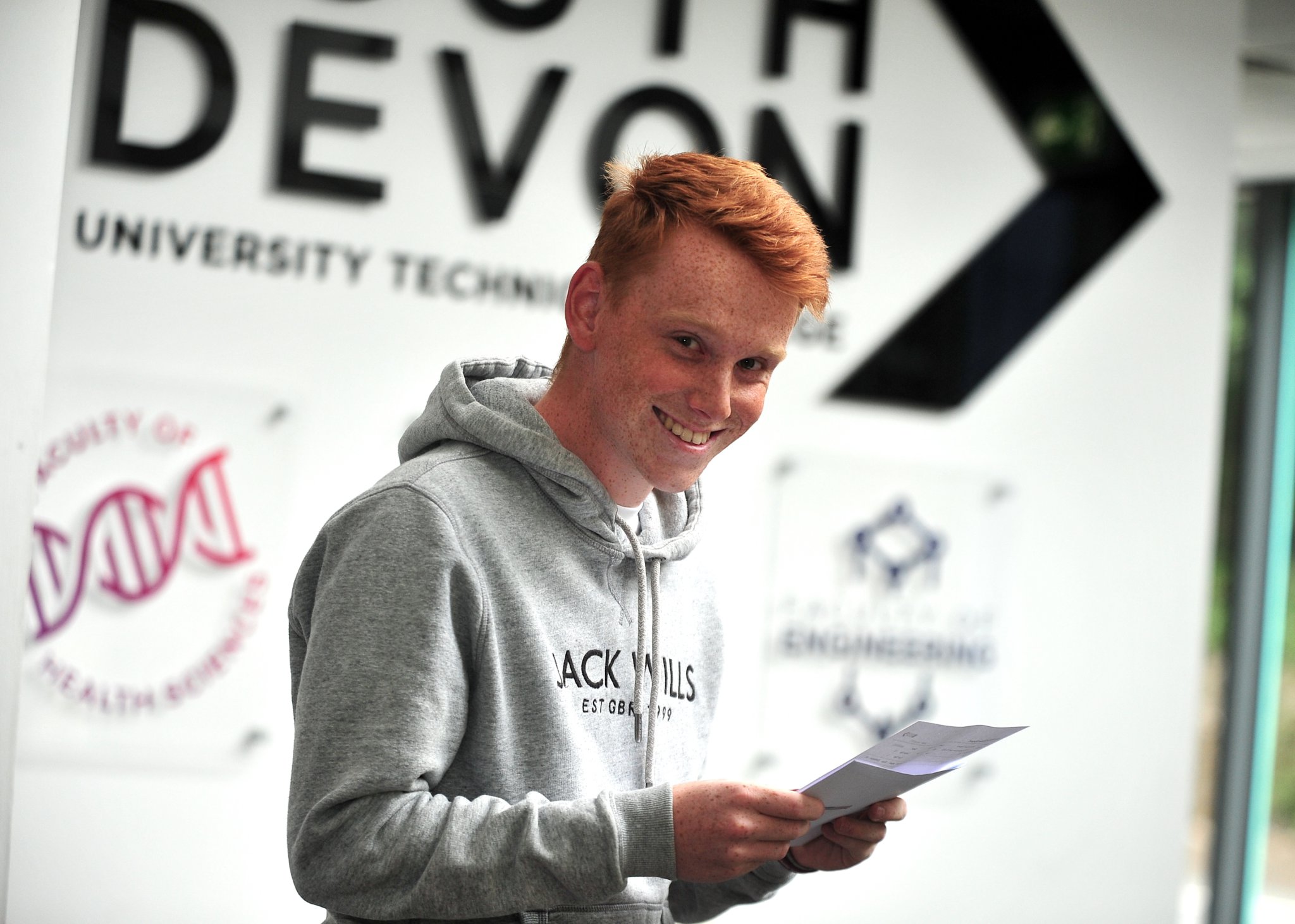 A-Level results at South Devon University Technical College. James Roberts obviously happy with his triple distinction in Triple Engineering BTEC.
The Kingsteignton student will be returning to the college at the start of the autumn term. ‘I’ll be back here at SDUTC in September,’ he explained. ‘But this time I’ll be wearing a staff lanyard and i.d. badge as I’ll be working here as teaching assistant specialising in engineering.’