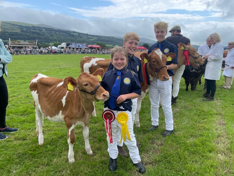 A family group of young exhibitors in the main ring. AQ 3979