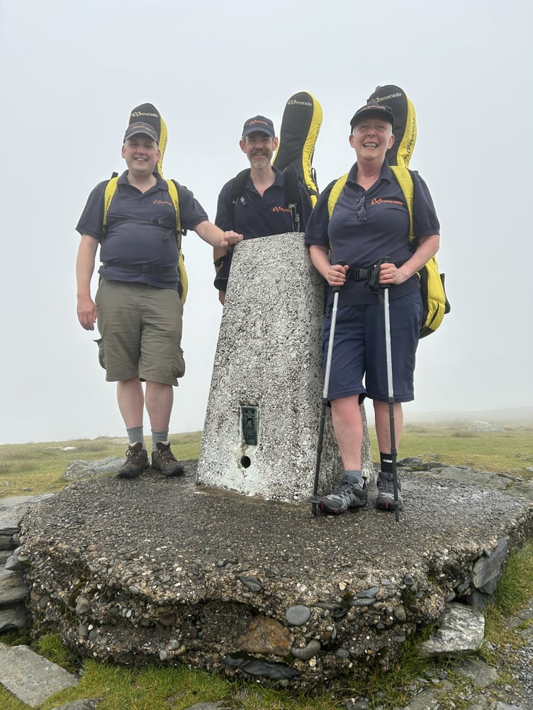 Extreme Cellists Jeremy Dawson, James Rees and Clare Wallace at the summit of Snaefell