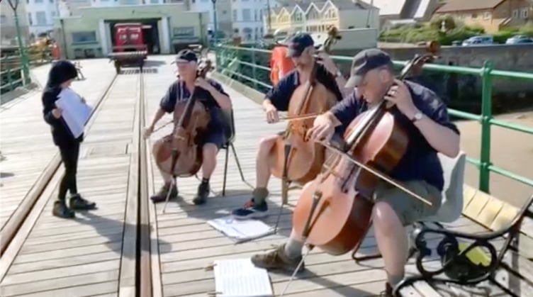 The trio performing on Queen’s Pier on Tuesday