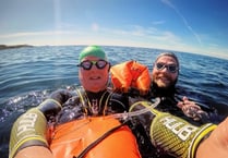 Pair complete charity swim against suicide