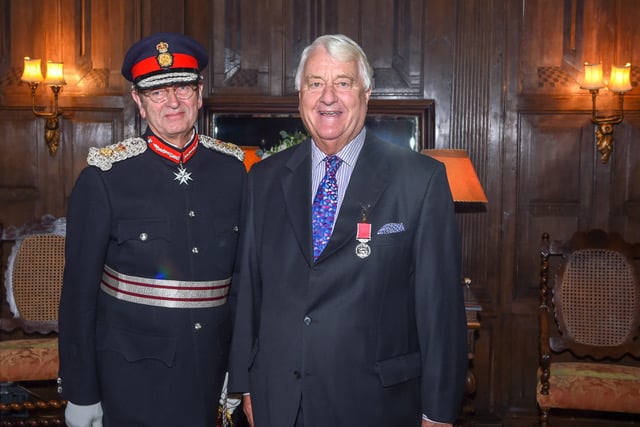 Haslemere is mourning the loss of a ‘larger-than-life character’, former mayor Michael Barnes – pictured being awarded the BEM by Lord-Lieutenant, Michael More-Molyneux in 2018