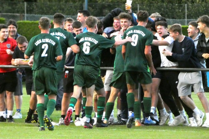 Liss Athletic players celebrate with their fans at Liphook United