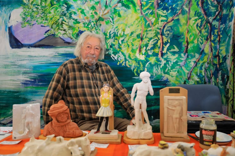 Shane Lucas with his carvings at the Isle of Man Art Festival held at Quayle's Hall. Photo by Callum Staley (CJS Photography)