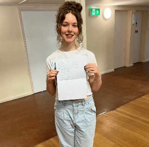 Jess Arnold celebrating GCSE success.