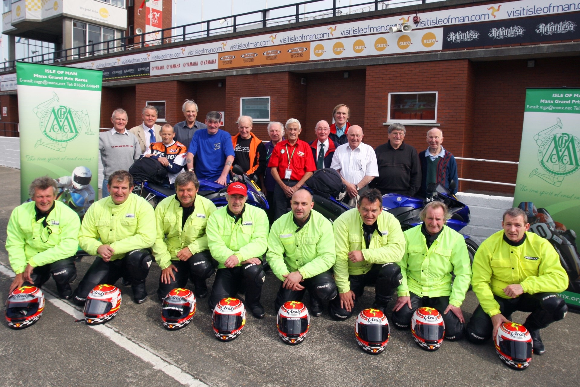 Pictured prior to the 2009 MGP travelling marshals past and present. Back row left to right: Neil Kelly, George Short, Chris Fargher, Bob Dowty, Jimmy Creer, Keith Trubshaw, Des Evans, Kipper Killip, George Costain, Brett Gaites, Jimmy Lynskey, Goo Owen, Frank Fox.
Front row left to right: Ned Bowers, Paul Hunt, Jim Hunter, Norman Kneen, Ian McVeighty, Dean Harrison, Dick Cassidy, Tony Duncan.