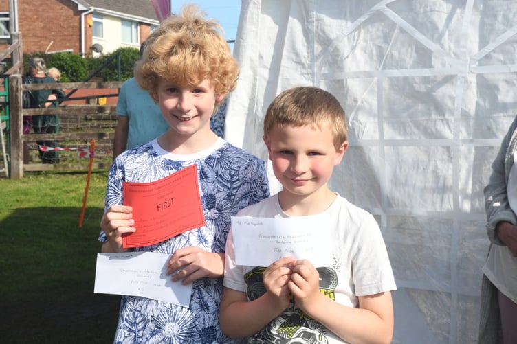 The Gloucestershire Federation of Gardening Societies Award for best radish went to Ben and Finn Heyworth. *** Local Caption *** The Gloucestershire Federation of Gardening Societies Award for best radish went to Ben and Finn Heyworth.