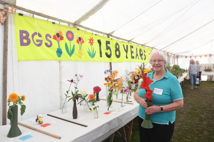 Show secretary Margaret Kidby with some of the exhibits ***