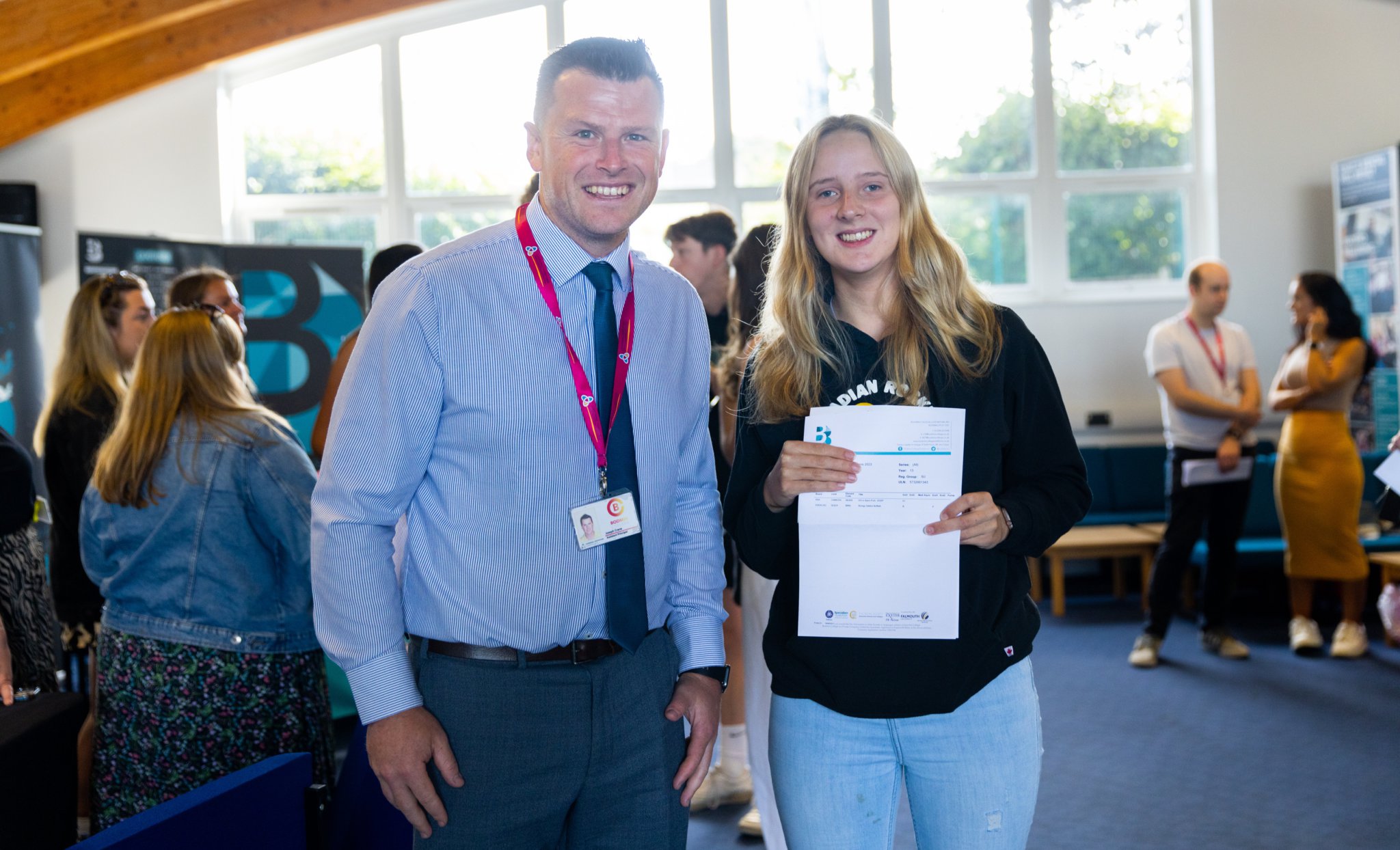 Mr Crane (head of Sixth Form) and Emily McKay receiving results