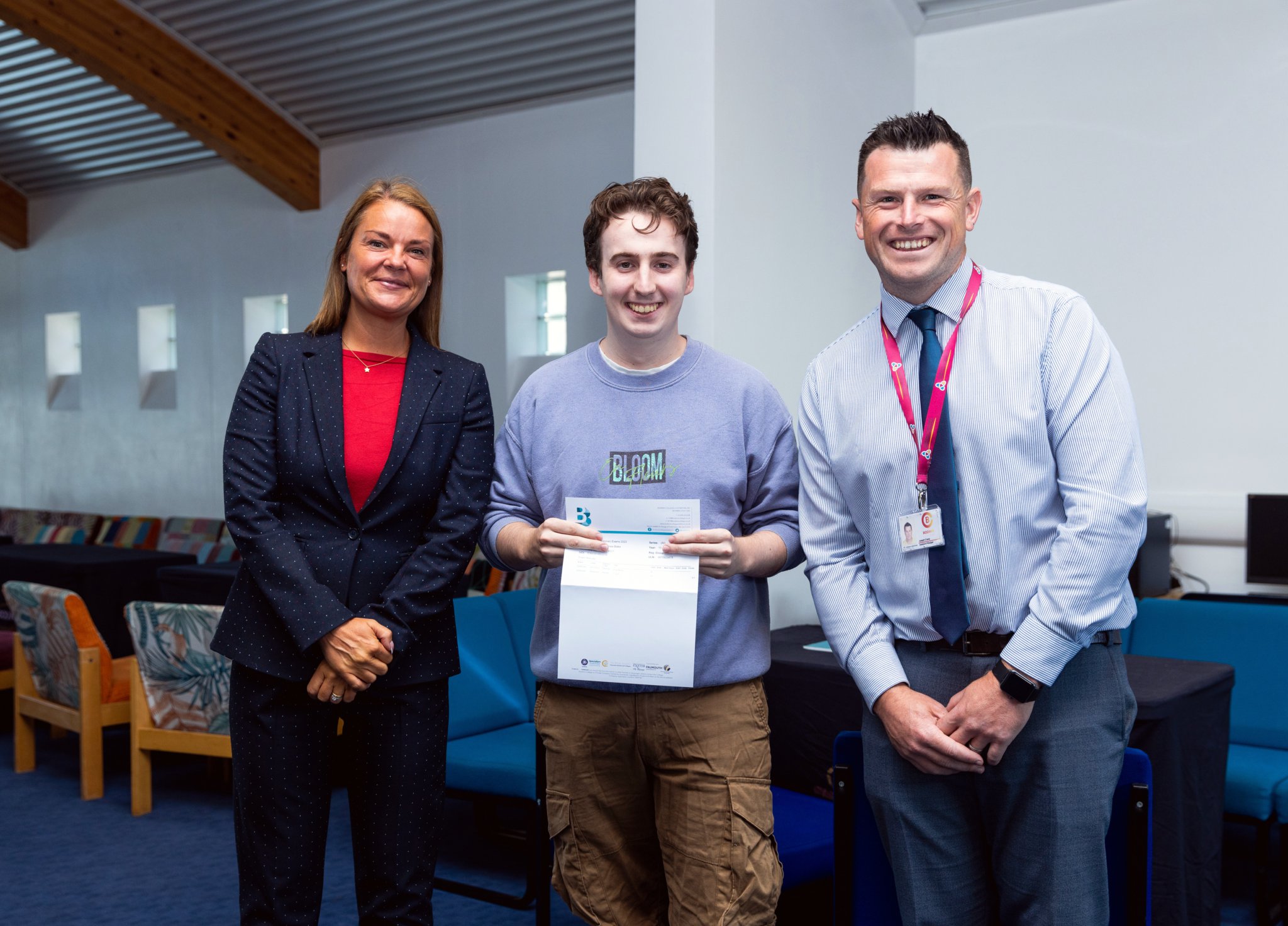 Mrs Guest (headteacher) with Tom Blake receiving results and Mr Crane (head of Sixth Form)
