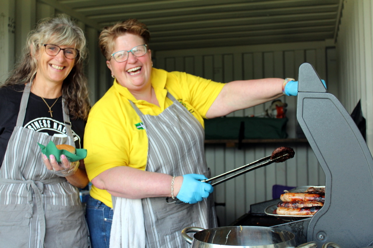 Running the barbecue for Posbury Church funds were Jenny Wreford (secretary of the Church Mission) and Fiona Mortimer (right, chairman Posbury Church Management Committee). SR 8784