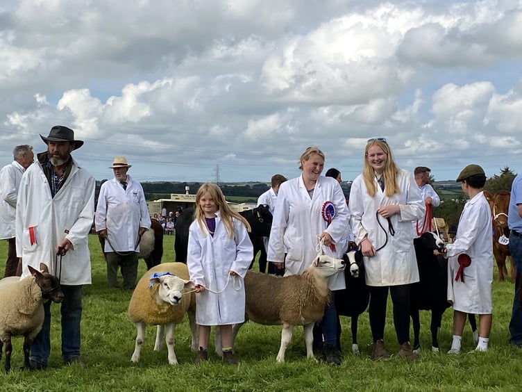 A group of livestock exhibitors taking part in the grand parade in the main ring