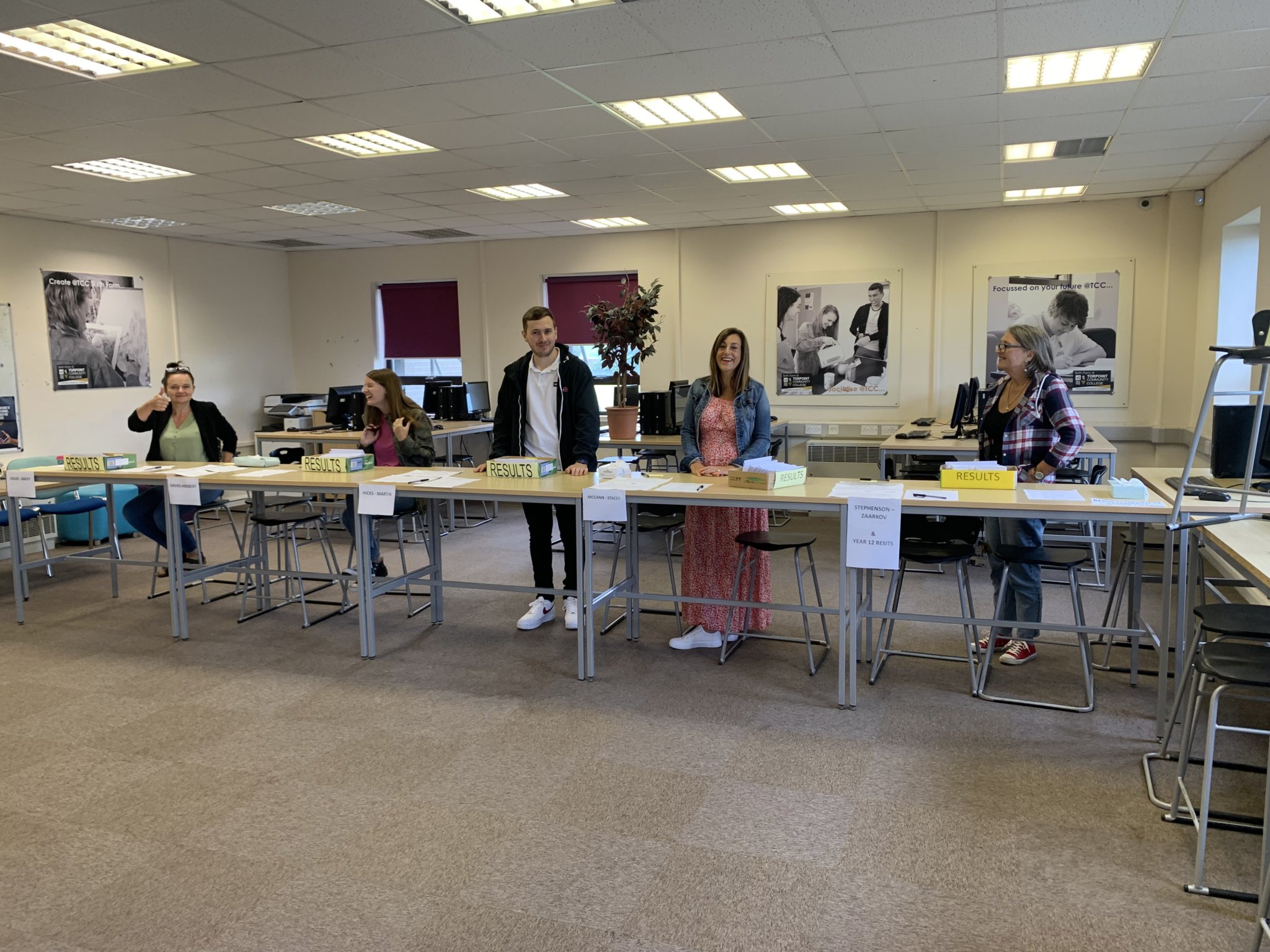 Staff eagerly await the arrival of students collecting their GCSE results at Torpoint Community College