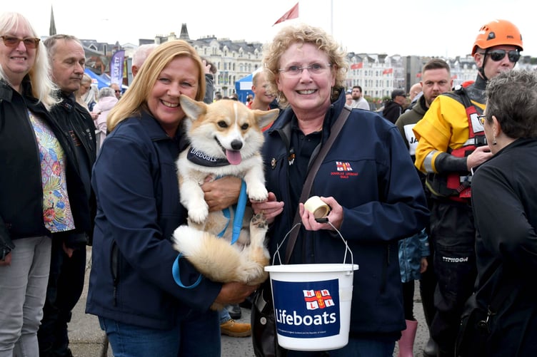 Thousands of people take part in a guided walk to the Tower of Refuge - pictured is Nicola Foden and Barbara Joughin, both members of the Douglas lifeboat Ladies’ Guild, with Teddy the dog