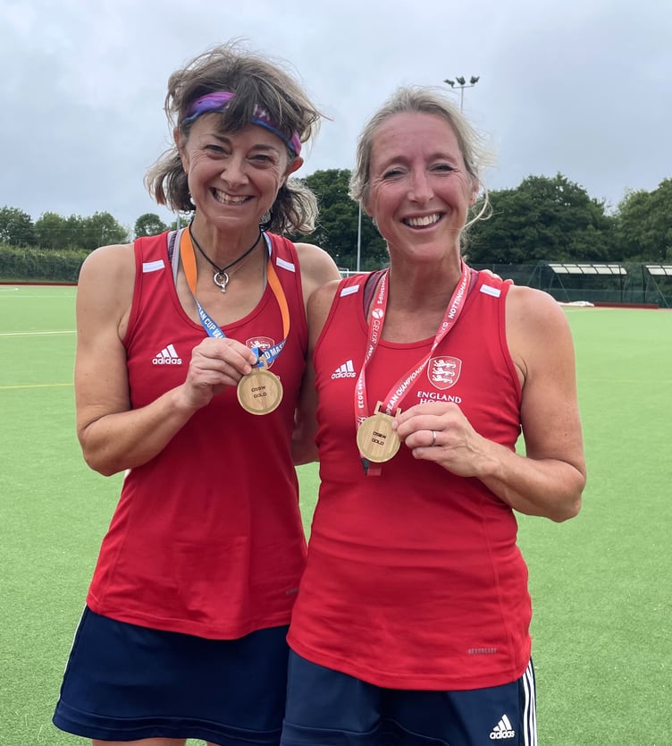Haslemere Hockey Club team-mates Heidi Wells (left) and Mel Redman pictured with their gold medals