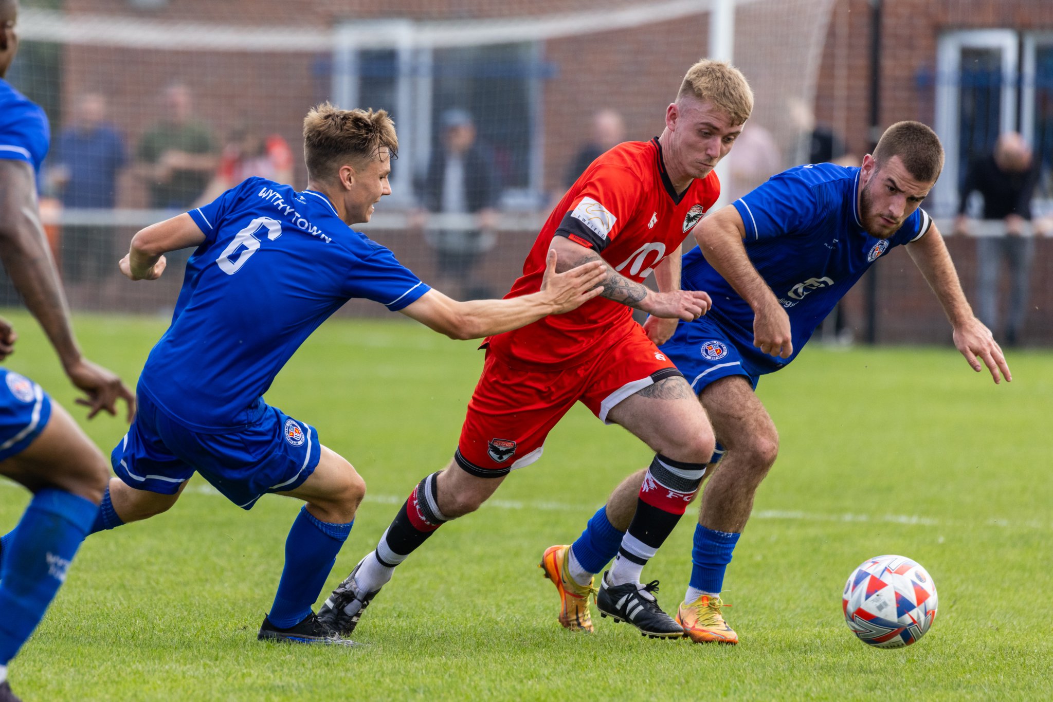 FC Isle of Man’s Joe Quayle looks to escape the attentions of two Wythenshawe players on Saturday afternoon (Photo: Gary Weightman)