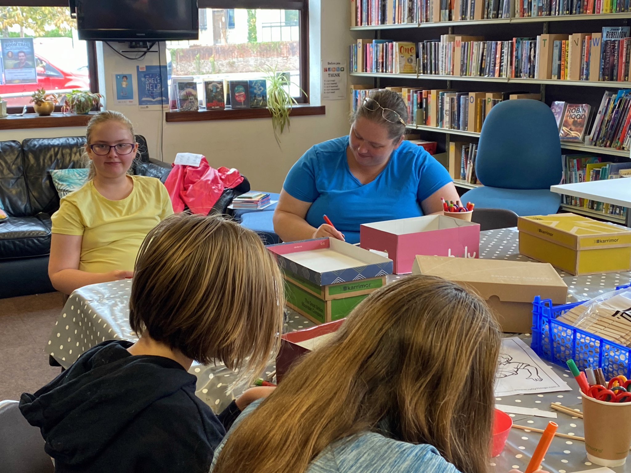 Taking part in the Mini Table Foosball Craft activity at Crediton Library. NP 310823 01