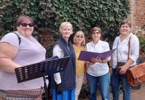 Choir gets Lion & Lamb Yard dancing with impromptu concert