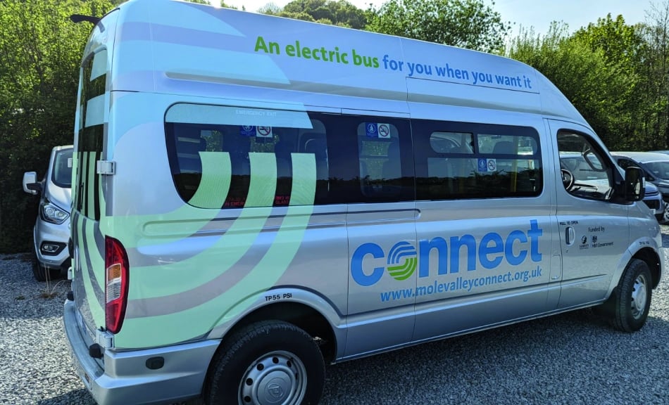 <p>The first Surrey Connect bus has transported passengers on more than 20,000 journeys since launching last year</p>