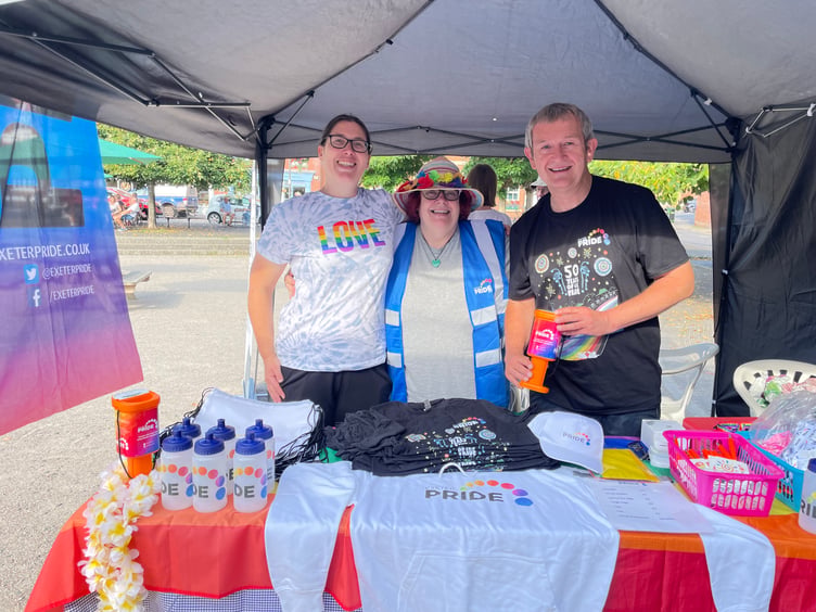 Carina Pearce, Julie Farrell and Alan Quick ran the Exeter Pride stall. AQ 6445
