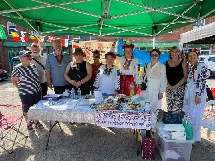 The Deputy Mayor of Crediton, Cllr Steve Huxtable with members of the Crediton Ukrainian group. AQ 6509