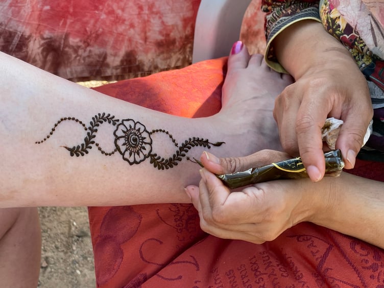 Henna tattoo work underway. AQ 6559