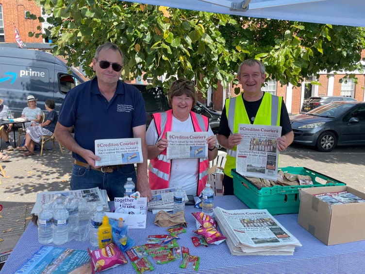 Packing goody bags on the Crediton Courier stand. AQ 6573