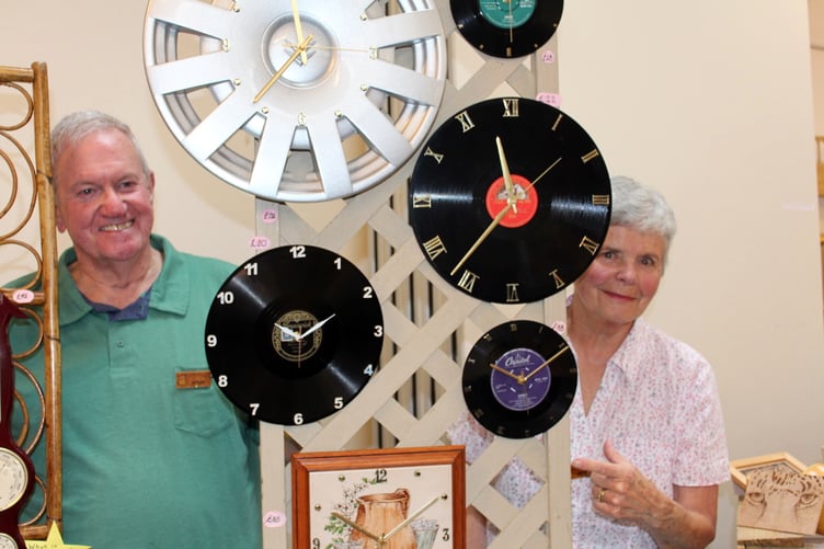 Just a very few of the clocks, made by Anthony Auty, even using a pair of old bellows - 'If it doesn’t move I can make a clock out of it,' he says, here with his wife. SR 8824