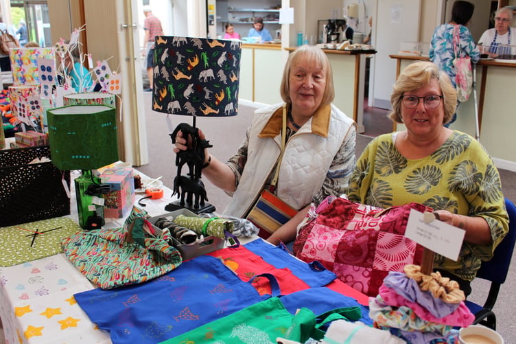 Sue Daly (right) and Carri Harrison, who both live in Crediton, dye and print fabrics to make lampshades, lined tote bags, fabric scrunchies for the hair, covered boxes and more. They can make to order and are found at most craft fairs. SR 8831