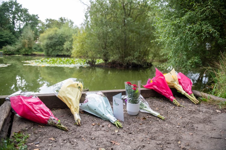 Flowers at Kingsley Pond after a woman has been arrested on suspicion of murder after a two-year-old girl died last night having been found in the village pond the day before. Kingsley, Hampshire, 12th September 2023.  See SWNS story SWBNpond.