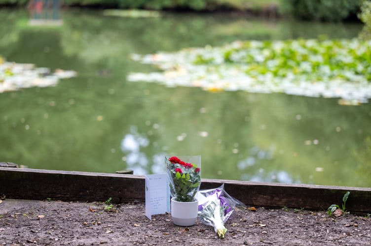 Flowers at Kingsley Pond after a woman has been arrested on suspicion of murder after a two-year-old girl died last night having been found in the village pond the day before. Kingsley, Hampshire, 12th September 2023  See SWNS story SWBNpond