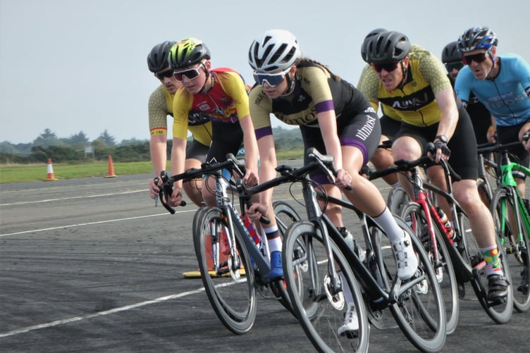 Team Utmost’s Sophie Smith on her way to winning the women’s title at the Isle of Man Closed Circuit Championships at Jurby on Sunday. Alongside her is youth rider Cameron Hounsell (Team RL360) (Photo: Gary Salisbury)