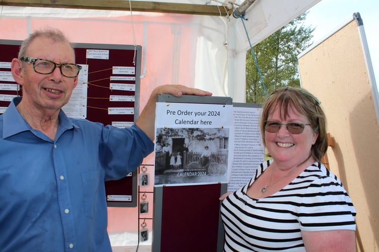 Advertising this year’s calendar featuring photographs of old Tedburn were Karen Fletcher and Malcolm Little of Tedburn History and Information Society. SR 8878