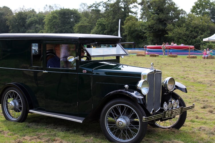 From Cheriton Bishop was Nicholas Bowater’s 1932 Morris 8 van, bought by him for £14 in 1955 being driven in the parade of vehicles. SR 8908