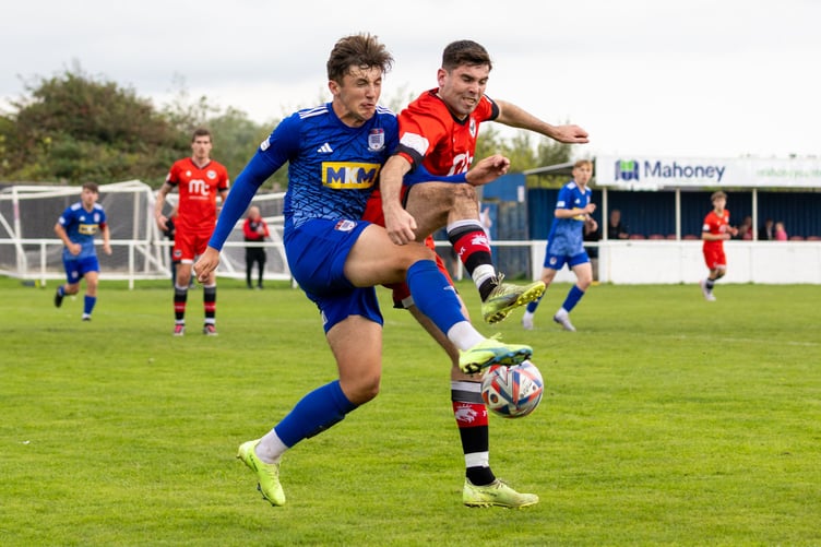 Ravens attacker Joe Walters - who was on the scoresheet - battles with a Squires Gate player for the ball in Blackpool (Photo: Gary Weightman)