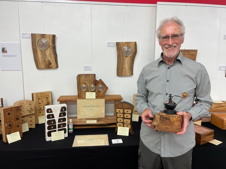 Steve Symes of Hollocombe Woodworking, near Winkleigh creates flat woodworked items including box drawers, trikes boxes, wall hangings, carvings and some larger items such as child’s chairs and is displaying a chair he created from an old door at The White Room Creative Space. AQ 6371