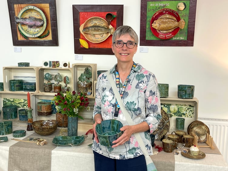 Sarah Holder of Ash Thomas, Halberton makes slab-built pottery items such as pots, bowls, plates, candlestick holders and vessels. She also makes papier macho images which are very popular. AQ 6377