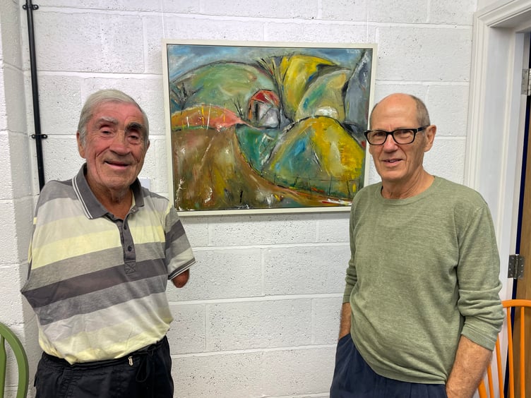 Patrick Leach, paints using oil on linen, pictured with Cllr Frank Letch, the chairman of Mid Devon District Council, who attended a launch event at The White Room Creative Space. AQ 6387
