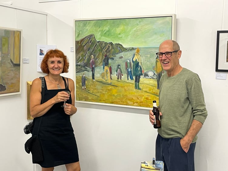 Patrick Leach, artist, beside one of this paintings with Bindy Saywood, director at The White Room Creative Space. AQ 6393