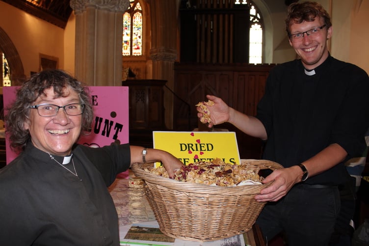 With the basket full of dried rose petals, the Rev Sandra Collier and the Rev Lewis Eden. SR 9072