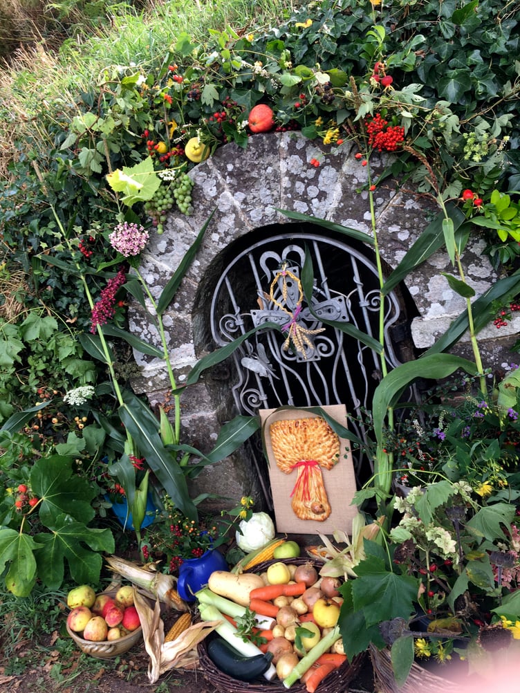 The decorated Holy Well.