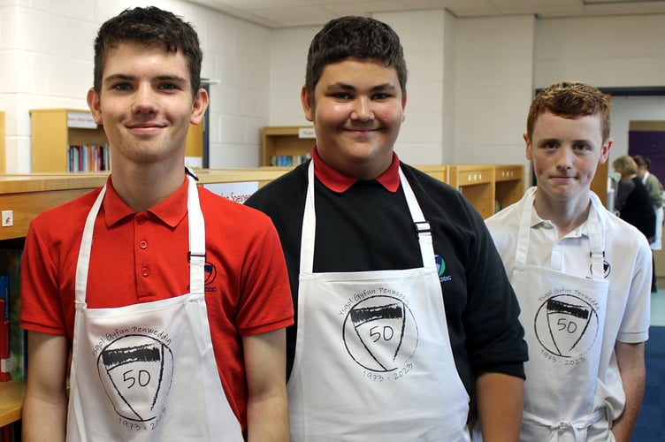 Current pupils Tomos, Noa and Llew helping at the open afternoon